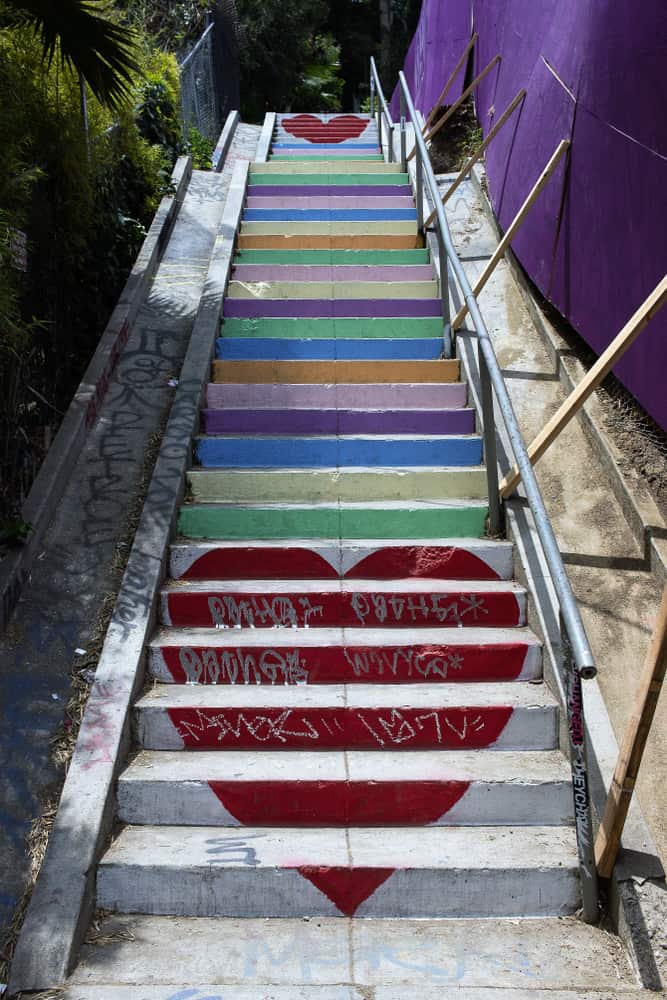 Famous rainbow step staircase in Los Angeles with hearts at top and bottom of stairs.