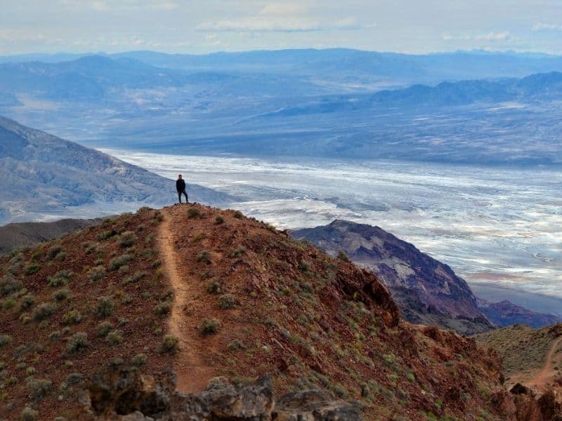 person overlooking the salt badlands from Dantes view