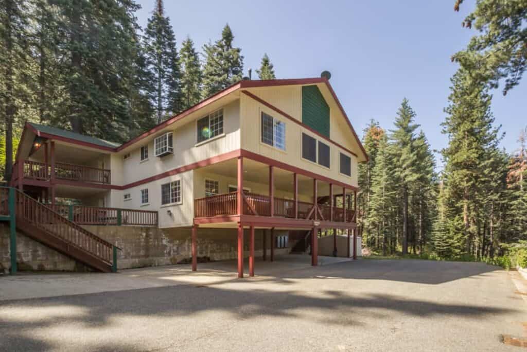 Yellow cabin with large patio and stairs