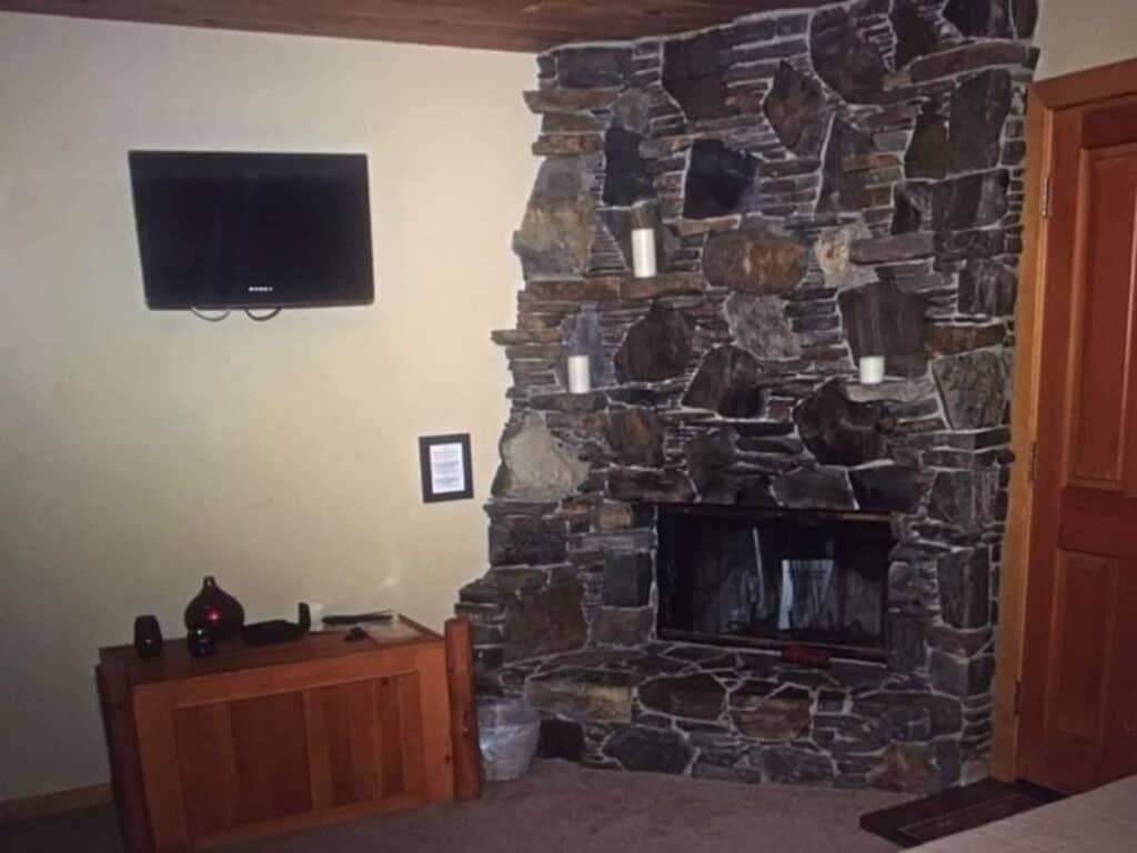 Fireplace view with flatscreen TV