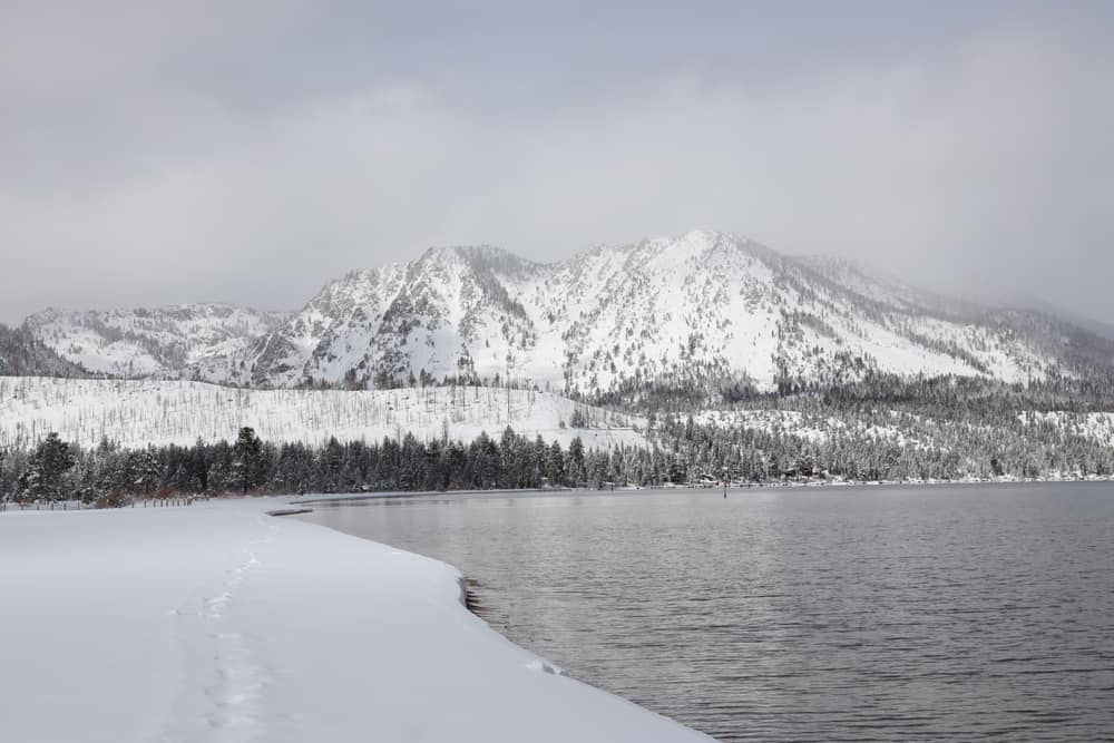 A cloudy day in Lake Tahoe in winter enjoying cross-country skiing next to the lake