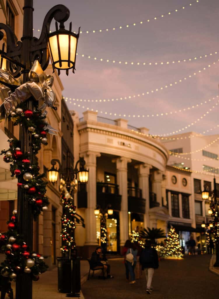 A photo of Rodeo Drive in Los Angeles at Christmas with holiday lights and decorations and trees