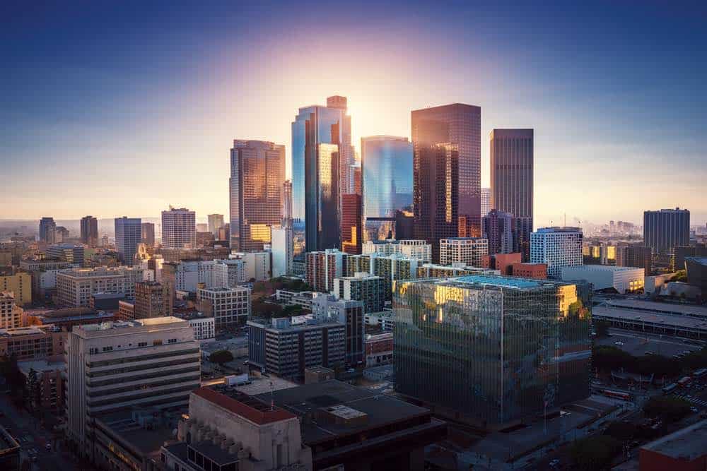 view of downtown Los Angeles with skyscrapers and pretty sunset light