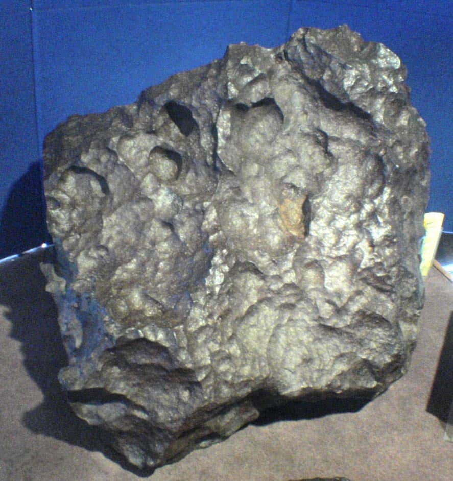View of the Old Woman Meteorite: silver-gray and large and rocky chunk of space rock