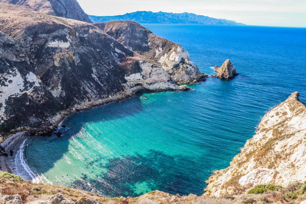 The beautiful "potato harbor" on Santa Cruz island: a turquoise inlet of pristine beach surrounded by cliffs.