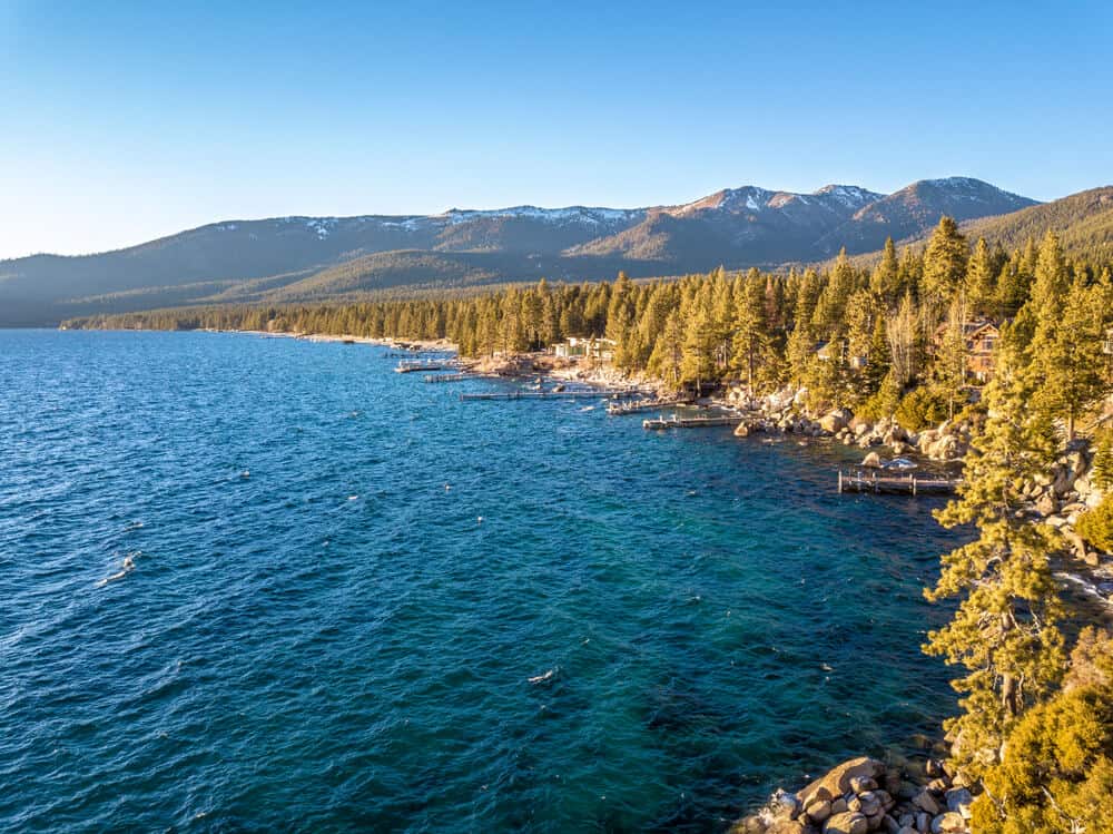 Emerald blue waters surrounded by pine trees and mountains on the west shore of Lake Tahoe, camping heaven!