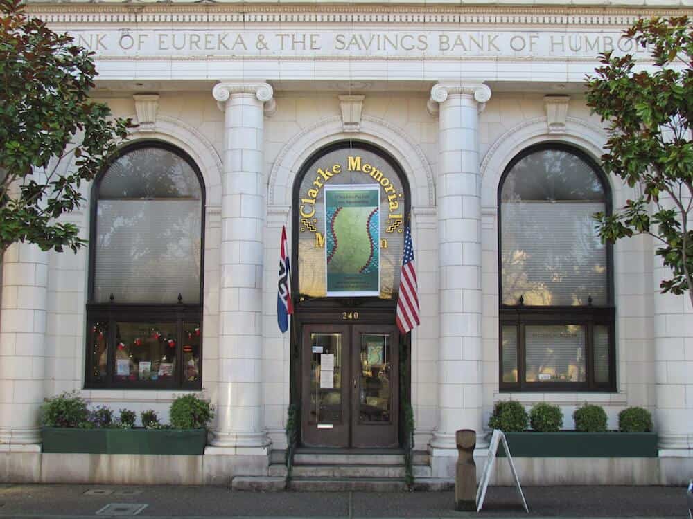 Clarke Memorial Museum housed in the old Bank of Eureka & Savings Bank of Humboldt County. Two flags in front.