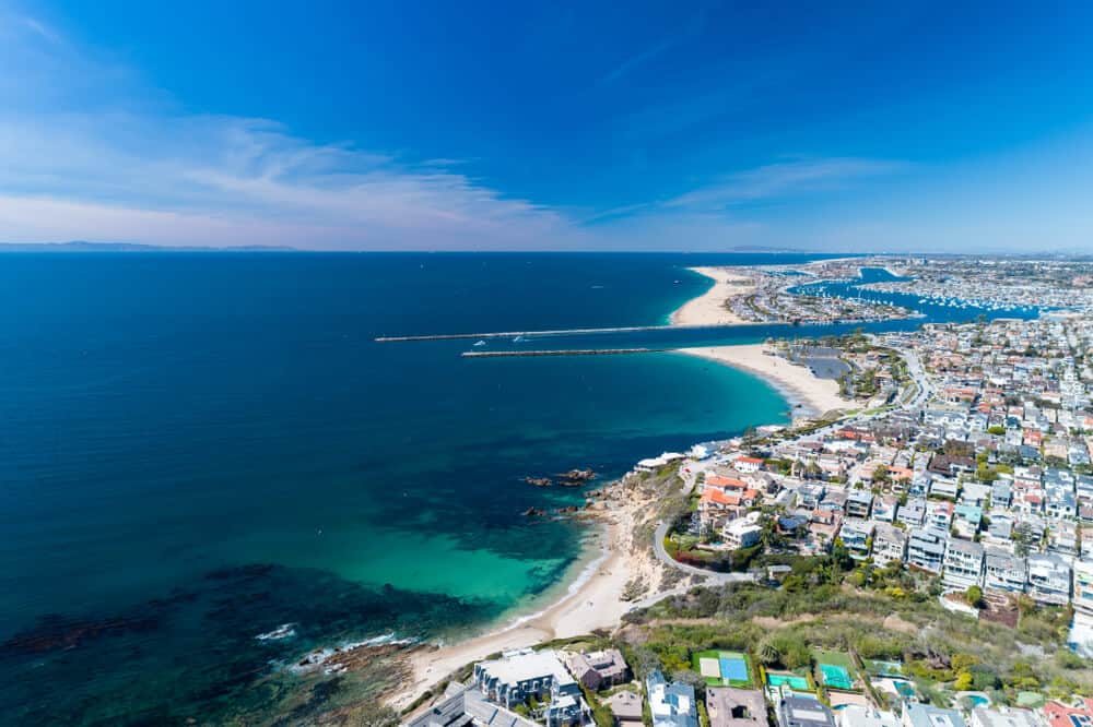 Aerial view over the city of Newport Beach in orange county as what you would see from a helicopter tour over the city.