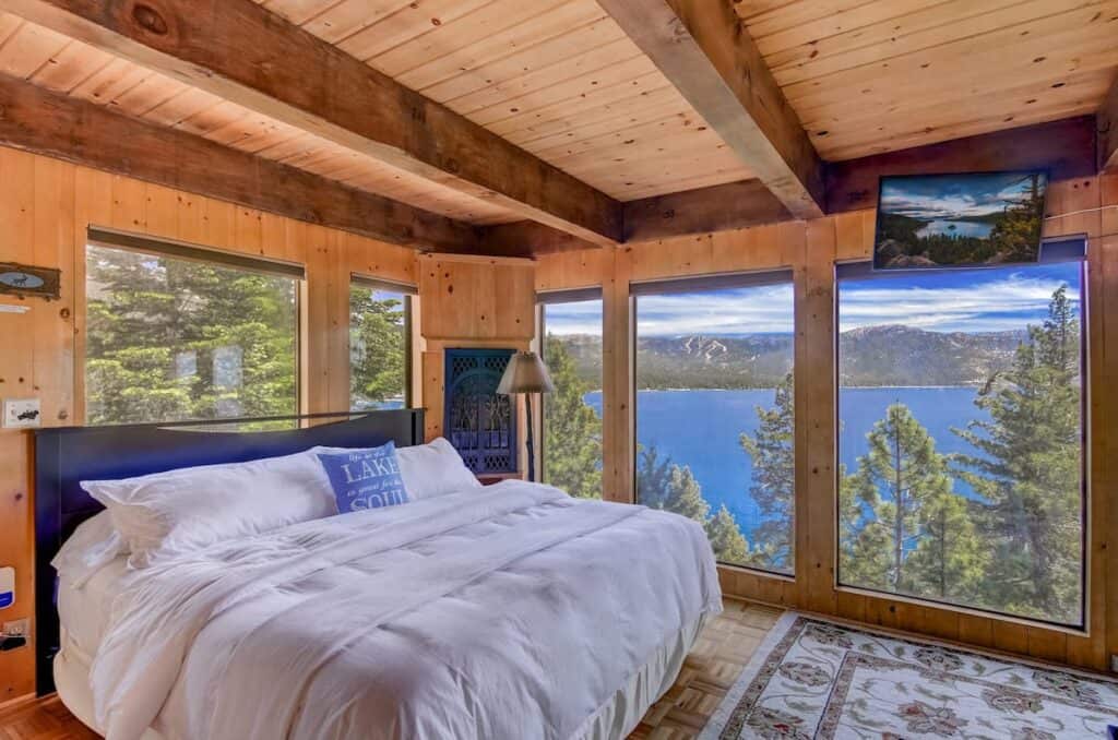 A small studio Airbnb in Tahoe with nearly floor to ceiling windows looking onto the brilliant blue waters of Lake Tahoe.