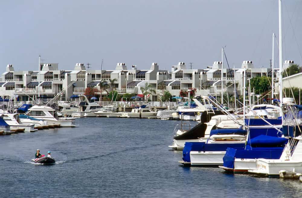 Fancy boats and fancy white houses of Huntington Harbor