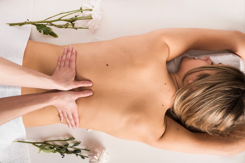A woman getting a massage at a spa