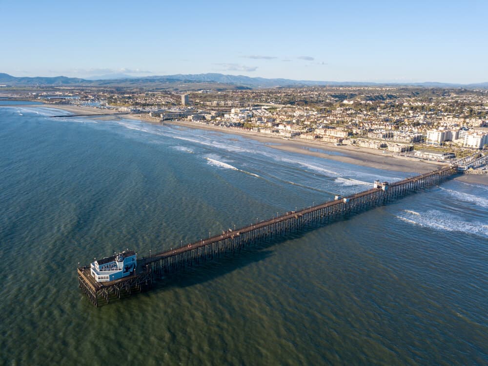 Oceanside Pier from an aerial view as if taken from a helicopter over the ocean