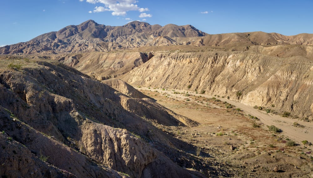 Rocky cliffs and mountains overlooking a valley on a hike in Anza Borrego along the mine outlook