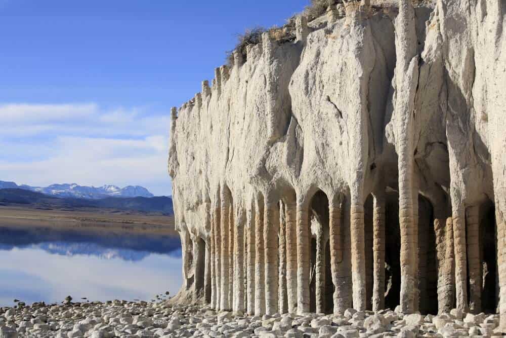 Strange stone columns that look as if they are manmade next to a lake, at Lake Crowley