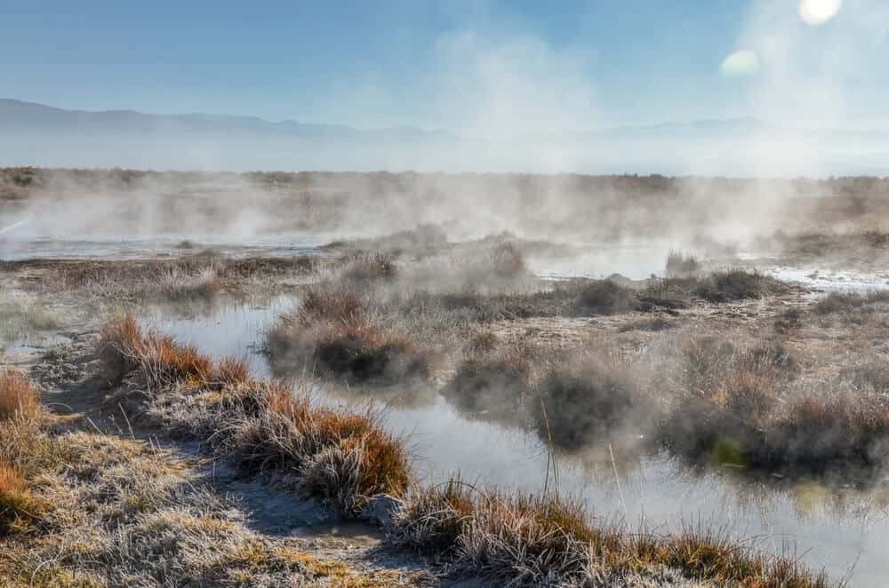 Steam rising off the creek waters in a geothermal hot spring near Mammoth, a popular place for stopping when road tripping Highway 395