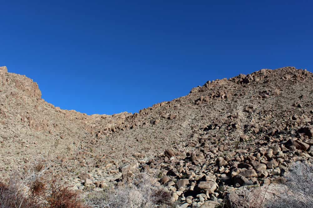 Below the deep blue Southern Mojave Desert sky rises ridges bounding Rattlesnake Canyon of Joshua Tree National Park.