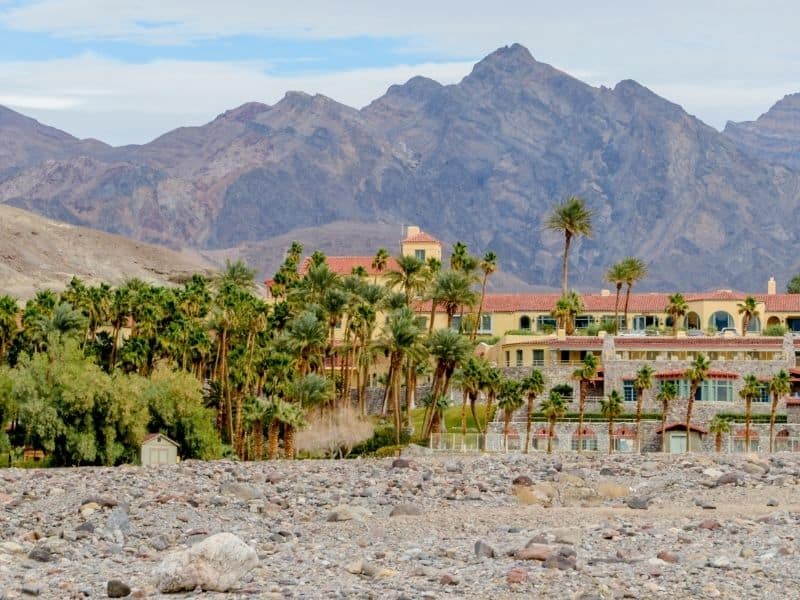 the inn at furnace creek surrounded by palms, oasis and mountains