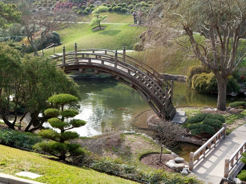 japanese style garden in los angeles with an arched bridge, one of the romantic things to do in los angeles