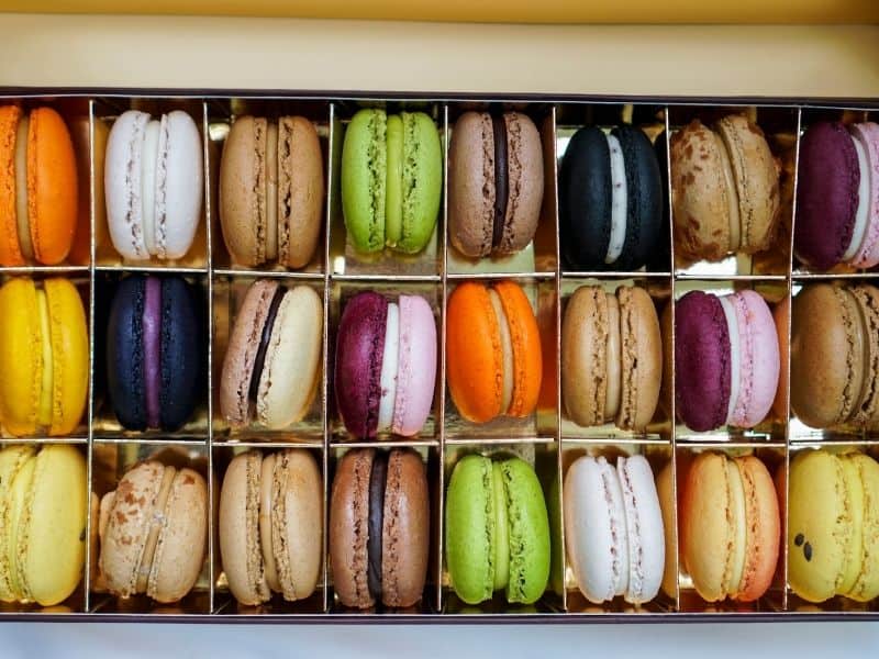 colorful box of macarons in every color of the rainbow