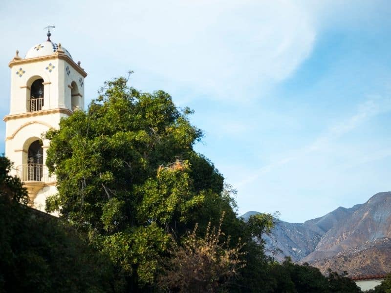 the famous tower of the chapel in Ojai with the mountain background on a sunny day in California 