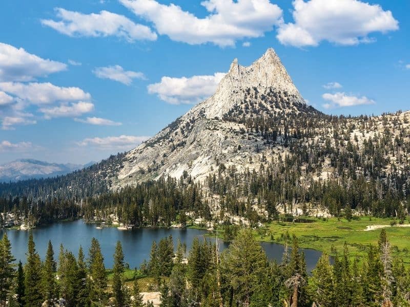 the brilliant blue lake water of cathedral lakes surrounded by cathedral peak