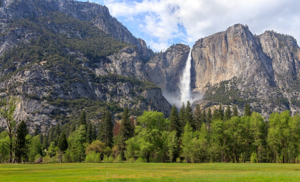 the yosemite picnic area with a giant waterfall in the distance