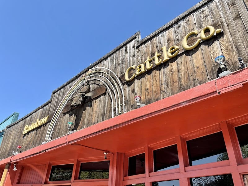 a sign for rainbow cattle company