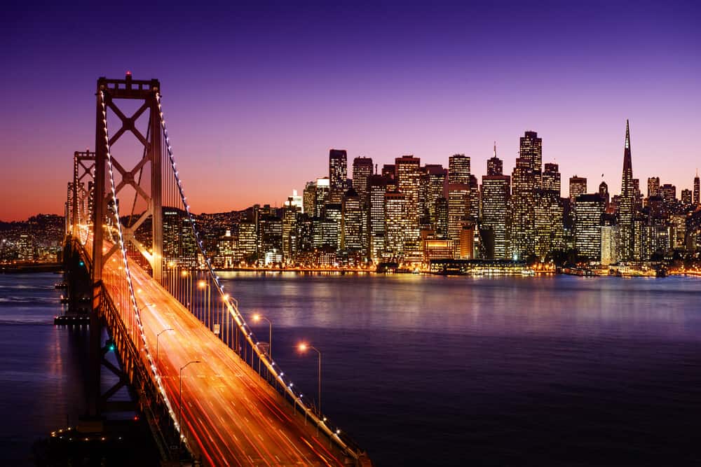 view of san francisco at night from the bay bridge