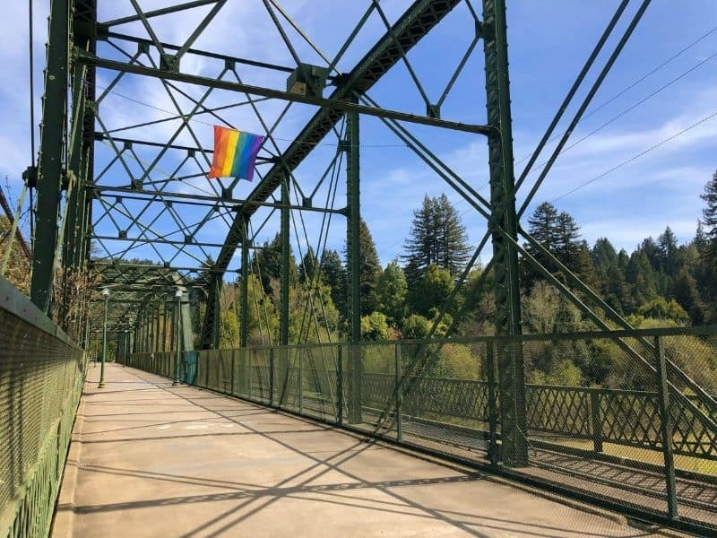 bridge in guerneville with rainbow flag