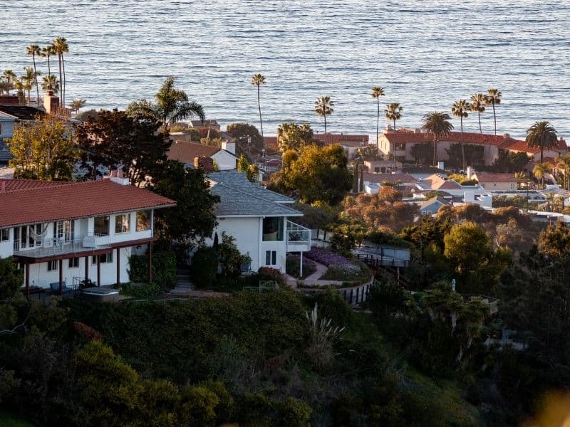 the beautiful oceanfront town of la jolla california with palm trees and houses