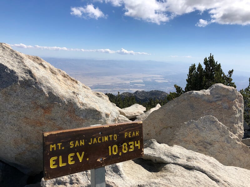 Sign at the summit of Mt San Jacinto that says "elevation 10834"