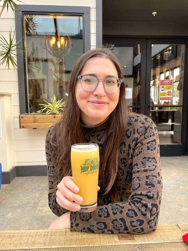 Allison (the author of the article) drinking a beer from hop dogma brewery in half moon bay