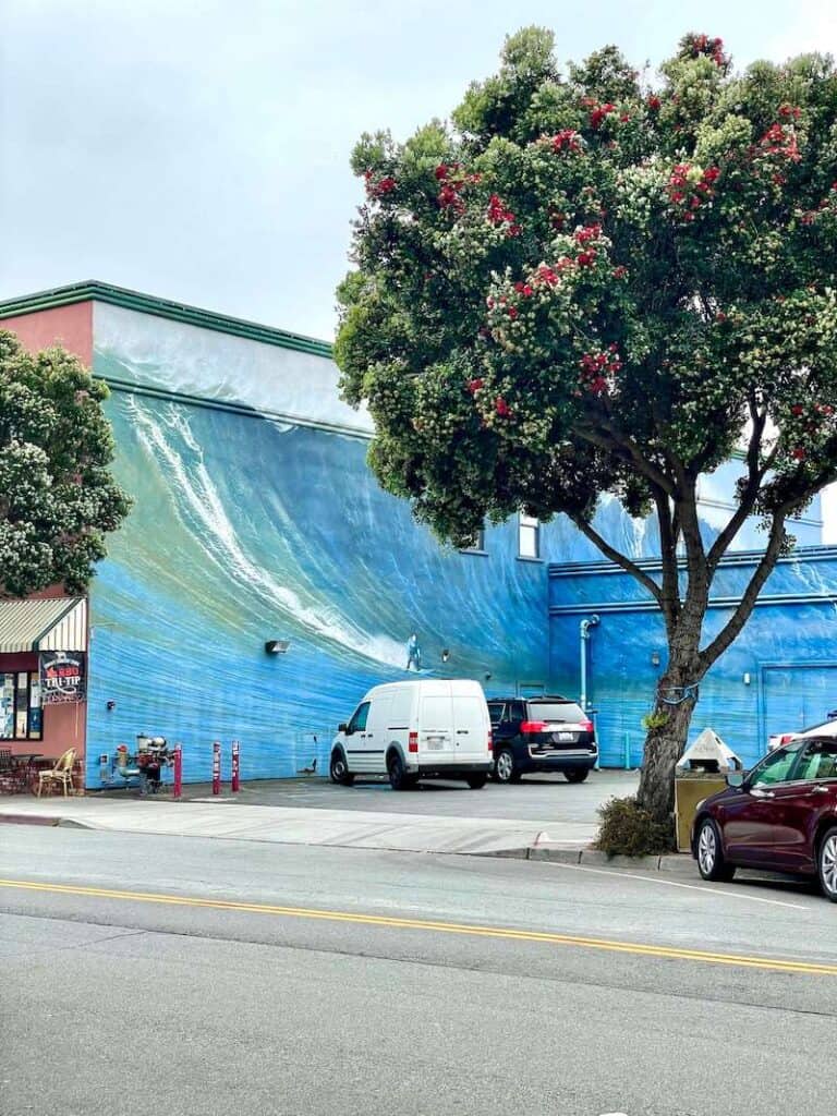 mural of a giant wave taking up two buildings