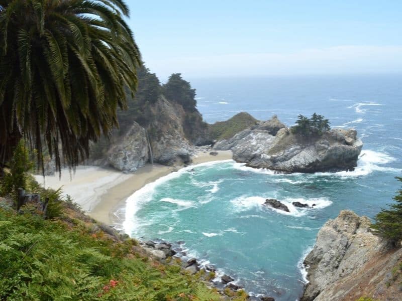 looking onto the famous tidefall (waterfall falling onto the beach) aka mcway falls in big sur