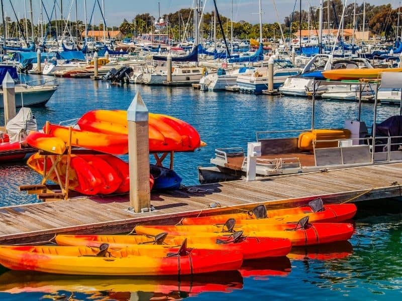 a row of kayaks in orange and red in mission bay california a great place for kayaking in southern california