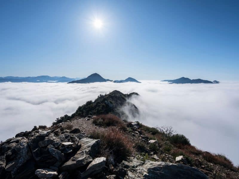 view from atop josephine peak looking towards strawberry peak on a sunny day above the fog line