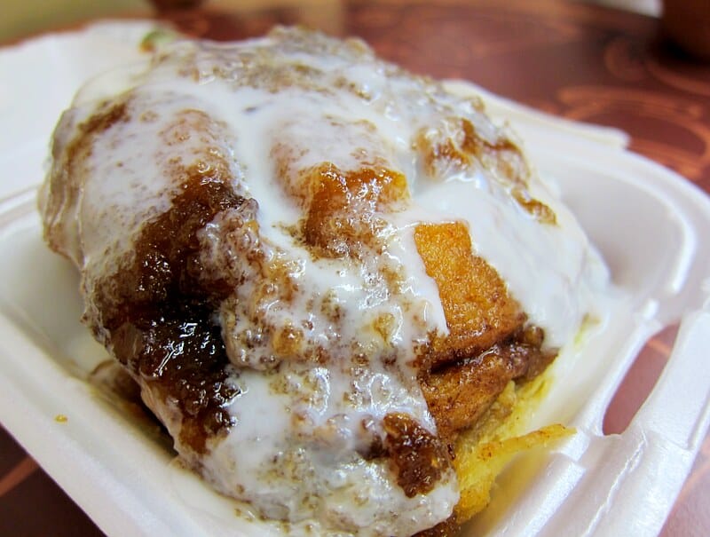 a giant sticky cinnamon roll at a bakery