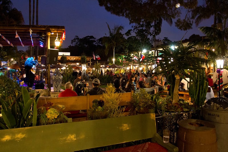 people gathering at tables sitting outside with groups of friends in old town san diego