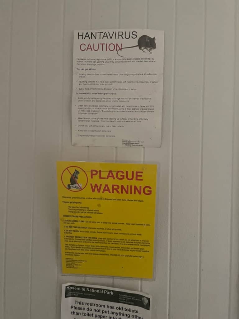 terrifying sign that reads 'plague warning' with a picture of a chipmunk on it