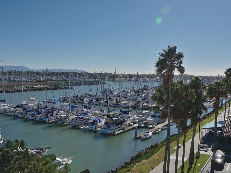 The charming harbor of Ventura California with lots of boats along the waterfront