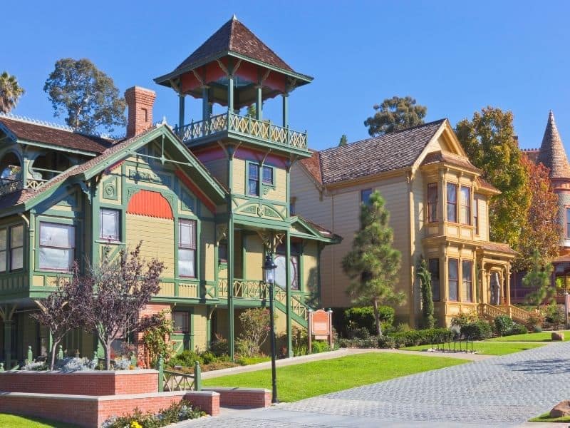 two buildings that are part of the old town san diego with old fashioned architectural style