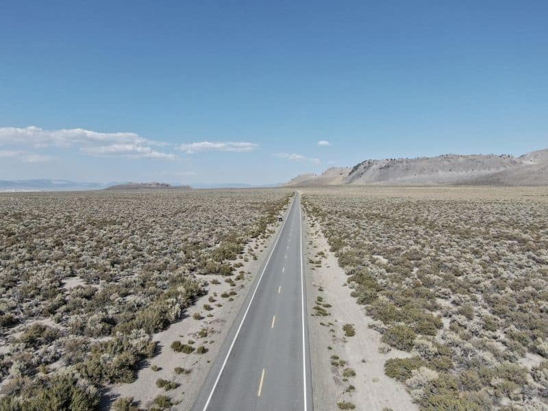 aerial view over a flat road in lee vining california