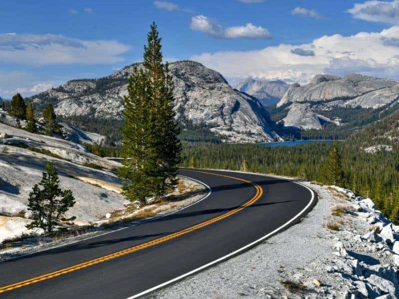 view of the tioga road looking over tenaya lake from the viewpoint at olmsted point