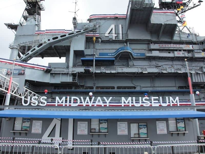 sign that reads uss midway museum located on a ship that is part of the museum complex