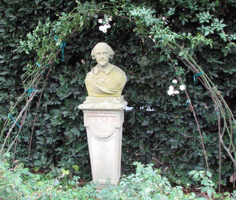 bust of william shakespeare surrounded by flora 