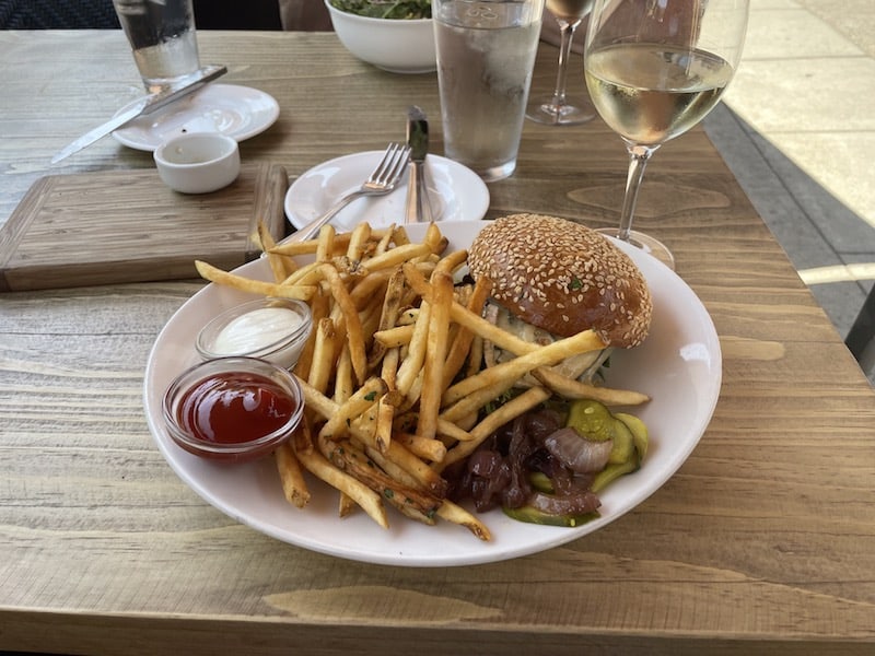 a perfect hamburger and fries and a glass of white wine at the girl and the fig on the sonoma square