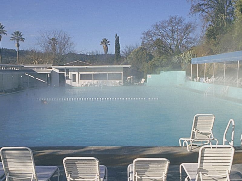 hot spring pool with pool chairs around it with no one in it in napa in winter