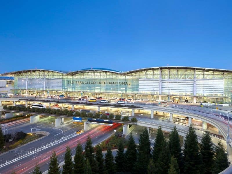 SFo airport at night lit up with cars arriving and departing