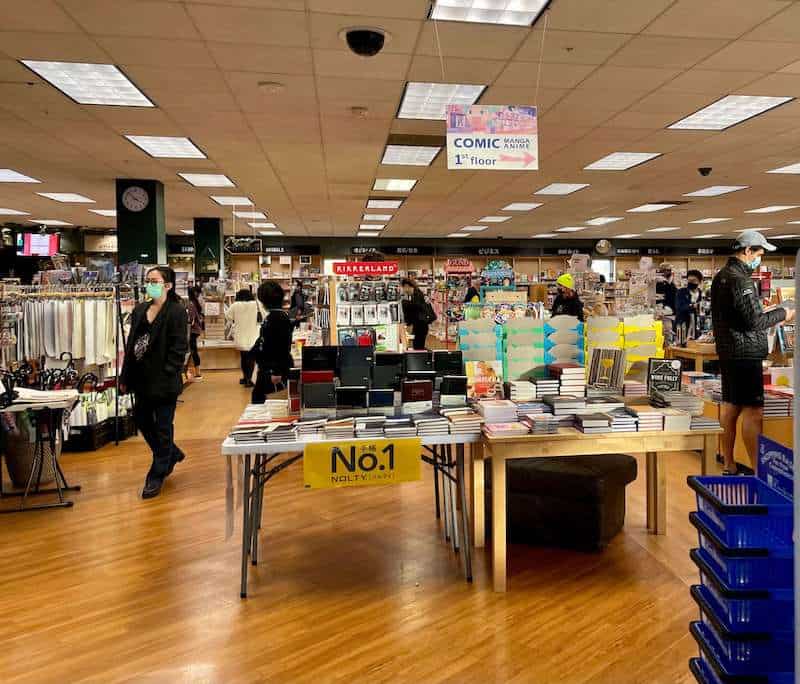 people browsing for books at the japanese bookseller Kinokuniya