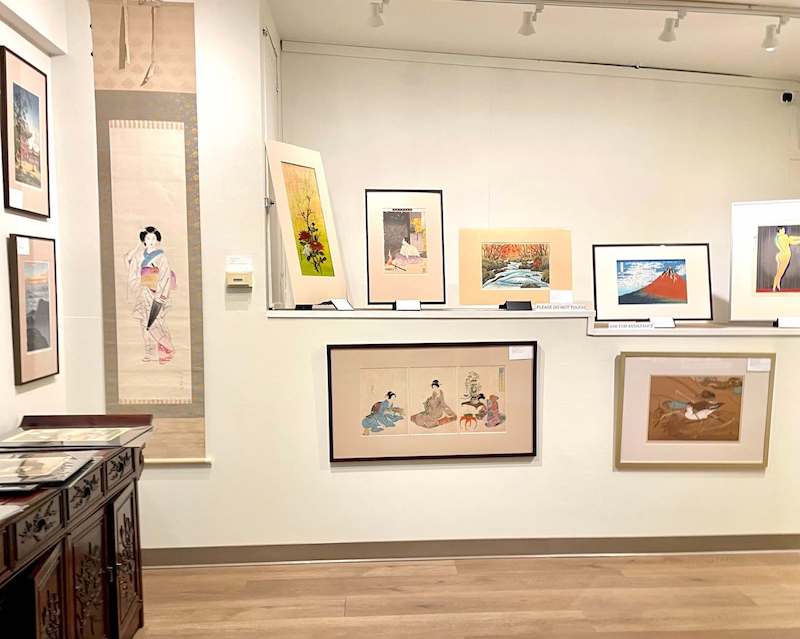 a selection of japanese woodblock prints in a gallery